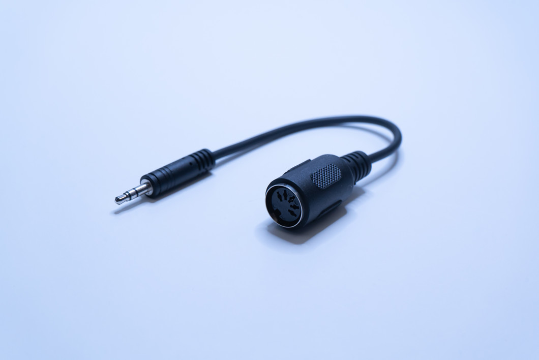 3.5mm TRS to 5-pin MIDI dongle.